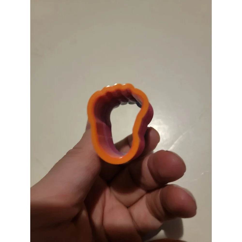 Mini Slinky Style Toy Rainbow Multi Color Spring Coil Foot Shape?